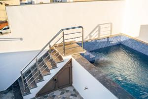 a pool of water with stairs in a building at Villa America Dakhla in Dakhla
