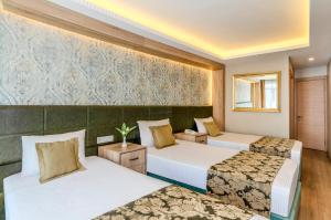 a hotel room with two beds in a room at Hotel Seren 2 in Istanbul +62 photos