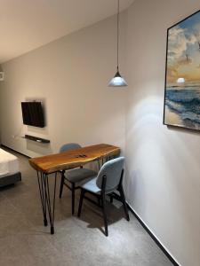 a dining room with a table and two chairs at Casa Del Sol Studio - Shengjin in Shëngjin