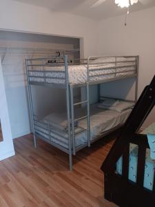 two bunk beds in a room with a staircase at Beautiful Riverview Condo with Boatlaunch in Bullhead City +31 photos