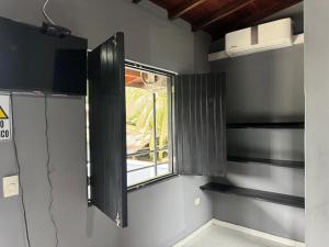 a small room with a window in the wall at Los Cabos in Bahía Solano
