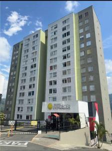 a large building with a sign in front of it at Ensueño 904 in Armenia