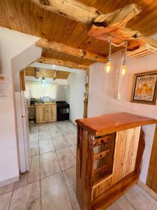 a kitchen with a wooden counter in a room at Cielo Azul 2 in Villa Pehuenia +13 photos