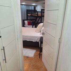 a room with a bed and a room with a door at Urbanutopia Apartment A109 in Villas del Mar