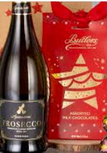 a bottle of wine next to a christmas present at Morecambes wise place in Morecambe