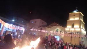 a crowd of people standing in front of a building at night at Alojamiento Lidia in Iruya