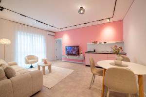 a living room with a couch and a table at Nova Apartments in Prizren
