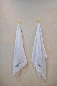 two towels are hanging on a wall at Riad Yamat privatisé au cœur de la Médina 3 chambres 10 min Jemaa el-Fna in Marrakesh +57 photos