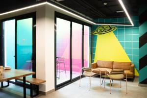 a living room with a couch and chairs at Funker Hostel in Málaga