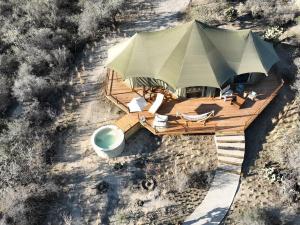 an overhead view of a patio with an umbrella at Hotel Omún, San Miguel de Allende in Dolores Hidalgo