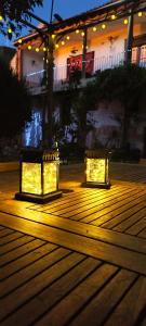 two lights on a wooden deck at night at Legado de San Ignacio, Peñafiel-Hasta 14 personas y parking privado in Peñafiel +79 photos