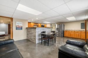 a kitchen with a table and chairs in a room at Mt Rushmore Duplex in Rapid City +14 photos