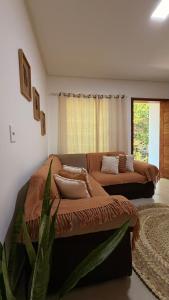 a bedroom with a bed and a couch at Espaço Move in Porto Seguro +7 photos