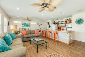a living room with a couch and a table at Paradise Point - Barefoot Beachfront Living in Surfside Beach
