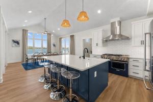 a kitchen with a large island with a counter top at Bay Dreaming in Montross