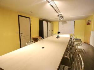 a conference room with a long table and chairs at Le Congo in Ochamps +32 photos