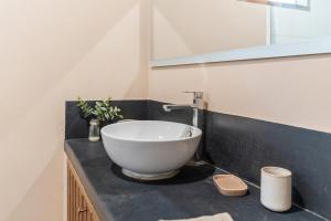 a bathroom with a large bowl sink on a counter at ALDEA DEL MAR by Villa del Sol in Máncora +49 photos