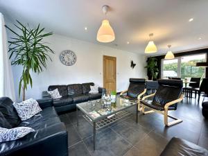 a living room with a couch and a table at Le Congo in Ochamps