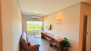 a living room with a couch and a table at Style and lightness 300m from the beach in Salvador