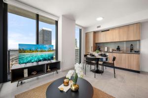 a kitchen and living room with a large window at 501 First Residences by Palermo Home Miami in Miami