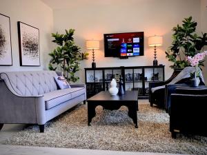 a living room with a couch and a table at Parker Strip Vacation Villa in Parker