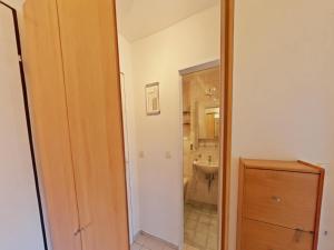 a bathroom with a toilet and a sink at Studio Roswitha mit Pool und Sauna in Freyung