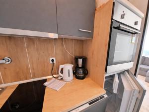 a kitchen with a counter with a coffee maker on it at Studio Martina mit Pool und Sauna in Freyung