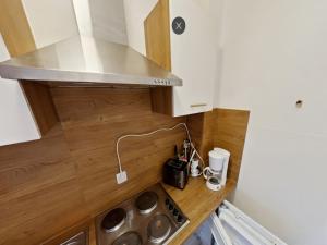 a small kitchen with a sink and a counter top at Studio Rainer mit Pool und Sauna in Freyung +30 photos