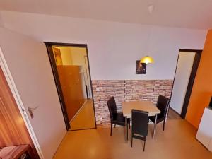 a dining room with a table and chairs at Studio Rainer mit Pool und Sauna in Freyung