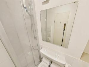 a bathroom with a shower and a mirror at Studio Sebastian mit Pool und Sauna in Freyung +29 photos