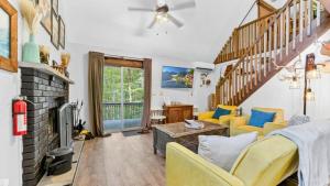 a living room with a couch and a fireplace at Bear Cabin Hideout in Hamlin
