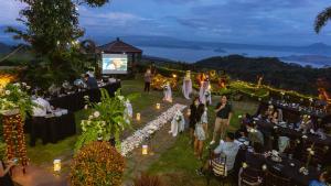 a wedding ceremony in the garden at night at Amega Hotel in Tagaytay