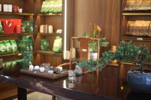 a room with a table with plants on it at Tea Hotel by Chien Hao in Ha Giang