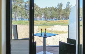 a table with two bottles and two glasses on a window at Junior in Binz +31 photos