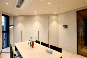 a dining room with a table and chairs at ASTY Cabin Seoul Serviced Residence in Seoul