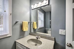 a bathroom with a sink and a mirror at Relaxing Getaway Near Everything in Kennebunk