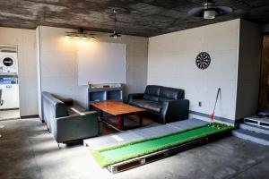 a living room with a couch and a table at Udo Torii Gate Stay Yoi in Nichinan