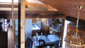 a room with a table and chairs in a house at Chalet Goldblick in Grächen