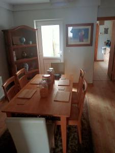 a wooden table in a room with chairs and a dining room at Mountjoy House in Derry Londonderry