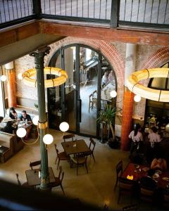 an overhead view of a restaurant with tables and chairs at Spiegel Home Studio in Semarang