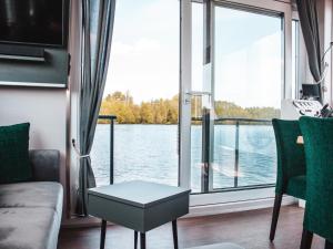 a living room with a view of the water at behagliches Floating Home in Berlin in Berlin