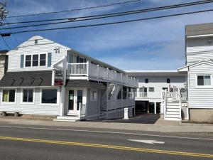 a white building on the side of a street at Oceanview Loft York in York