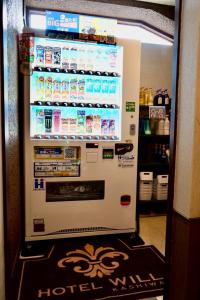 a refrigerator with a lot of drinks in it at Hotel WILL Kashiwa in Kashiwa