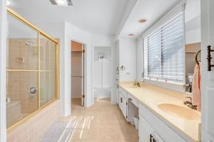 a bathroom with a sink and a shower at Bee Happy at the Lake in Canyon Lake +31 photos