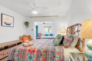 a bedroom with a bed with a colorful blanket at Bee Happy at the Lake in Canyon Lake