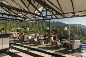 a restaurant with a view of the mountains at Oakwood Cameron Highlands in Cameron Highlands