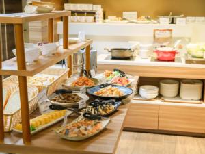 a buffet line with many different types of food at Hotel Sakura Suite Osaka Juso in Osaka