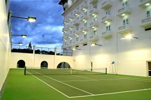 a tennis court in front of a building at Sai Gon Da Lat Premium in Da Lat