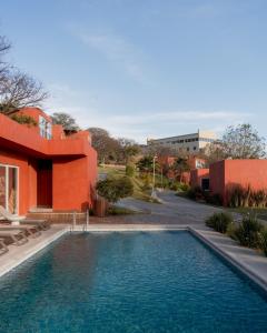 a swimming pool in front of a building at Casa Maja Villas Chapala in Chapala