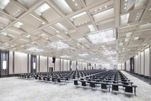 an empty lecture hall with rows of benches at Pan Pacific Serviced Suites Ningbo in Ningbo +259 photos